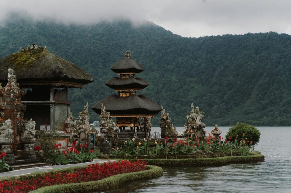 Breathtaking landscape of Ulun Danu Beratan Temple with lake and mountains in Bali.