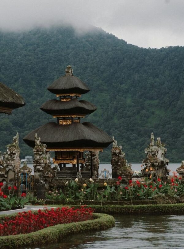 Breathtaking landscape of Ulun Danu Beratan Temple with lake and mountains in Bali.