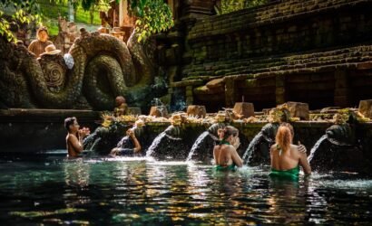 a group of people sitting in a pool of water