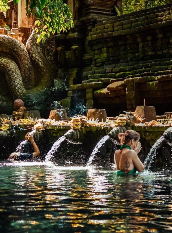a group of people sitting in a pool of water