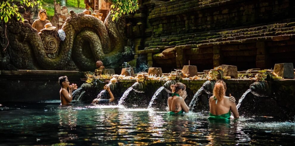a group of people sitting in a pool of water