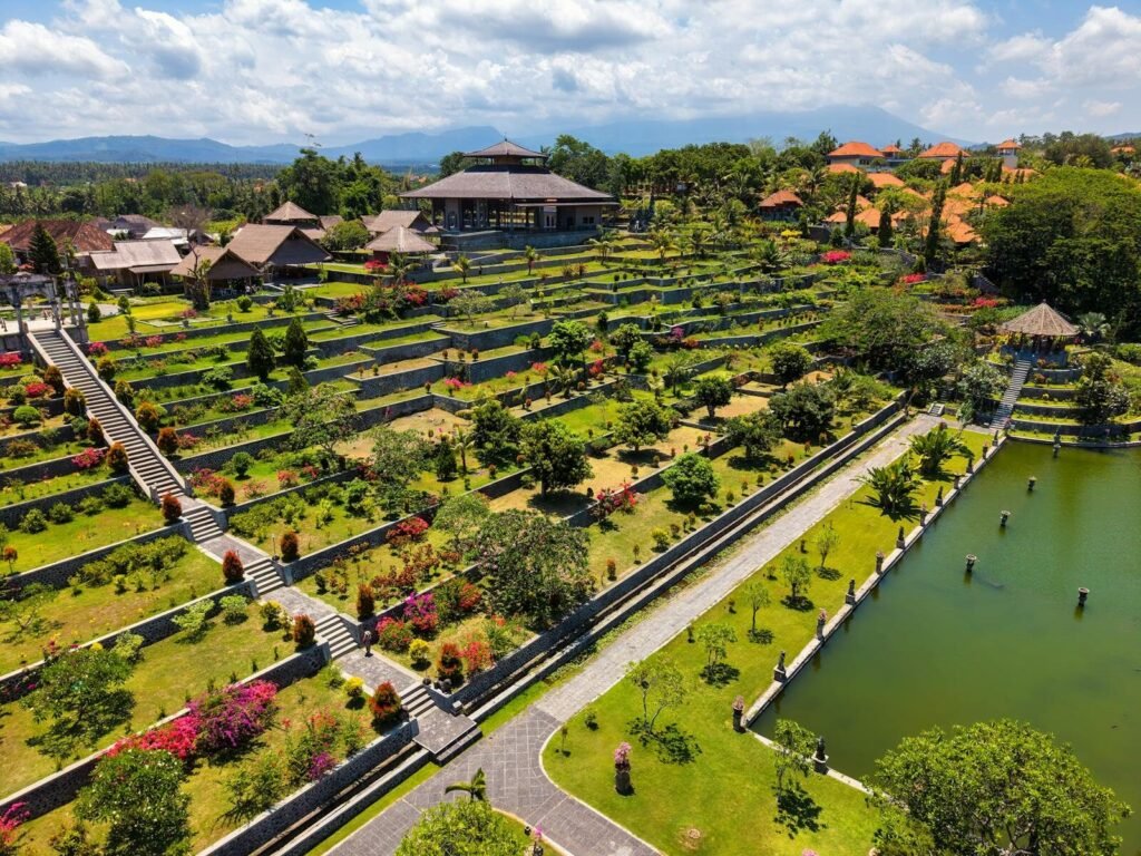 Discover the stunning terraces and lush greenery of Tirta Gangga Water Palace in Bali, Indonesia.