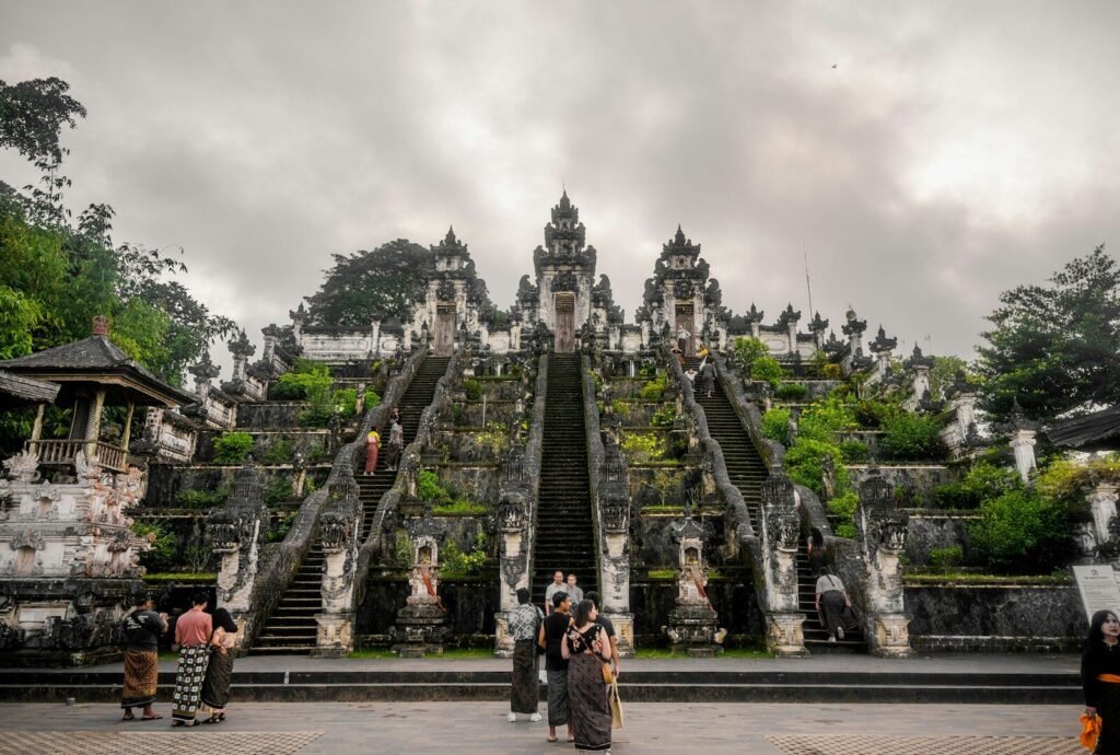 a group of people standing in front of a large building