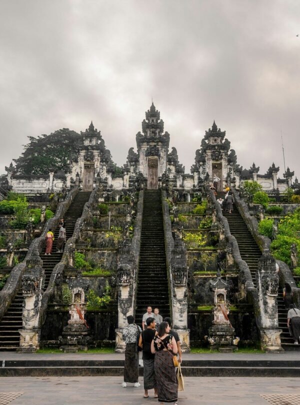 a group of people standing in front of a large building