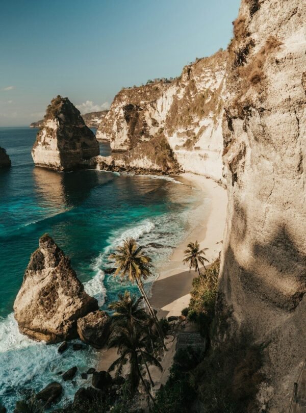 Diamond Beach with white sand and turquoise water below limestone cliffs in Nusa Penida