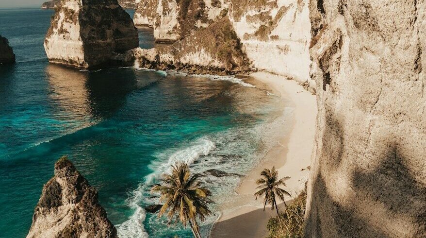 Diamond Beach with white sand and turquoise water below limestone cliffs in Nusa Penida
